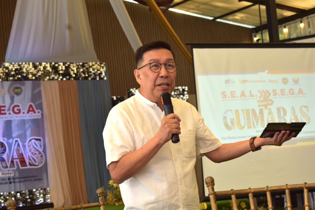 Mr. Francis Gentoral speaking to attendees during the S.E.A.L. to S.E.G.A. entrepreneurship program in Guimaras.